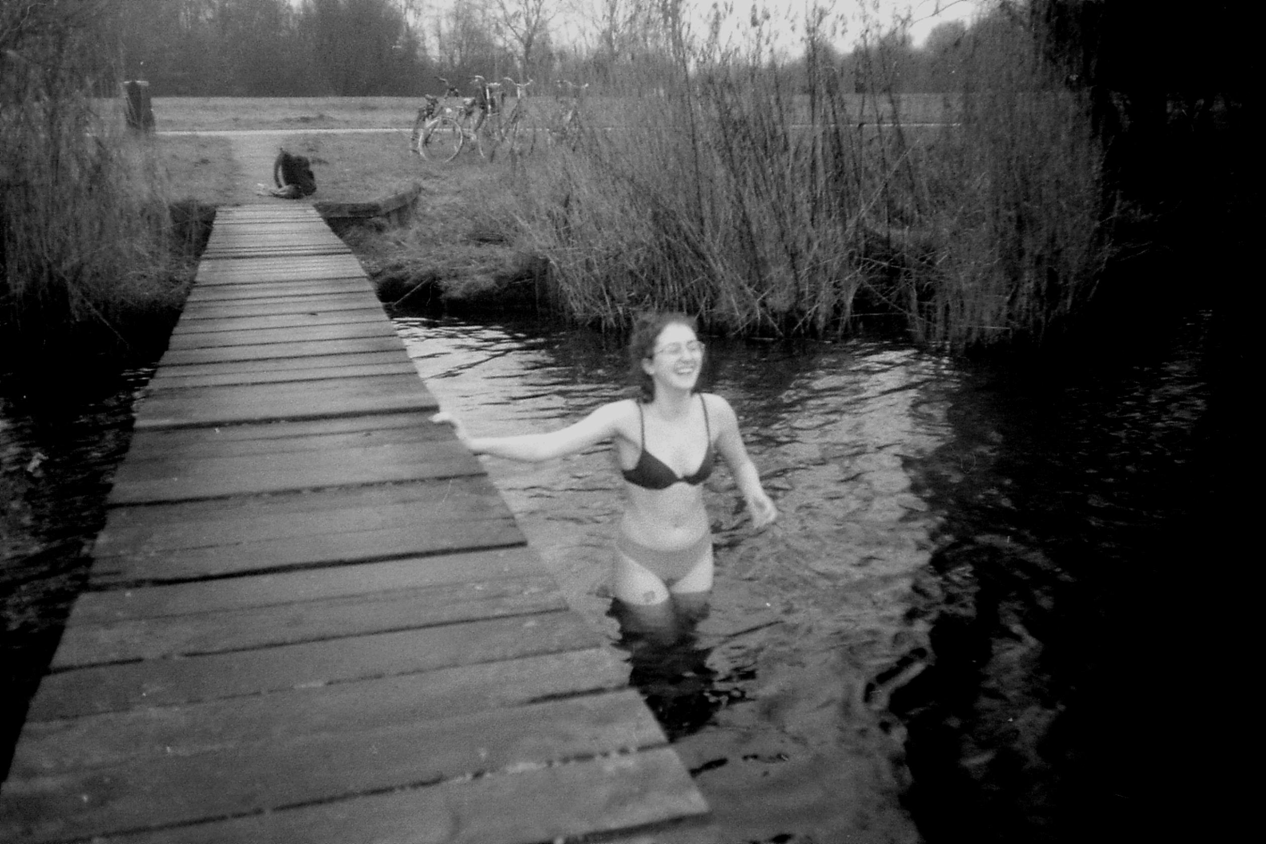 dani in her underwear in a lake