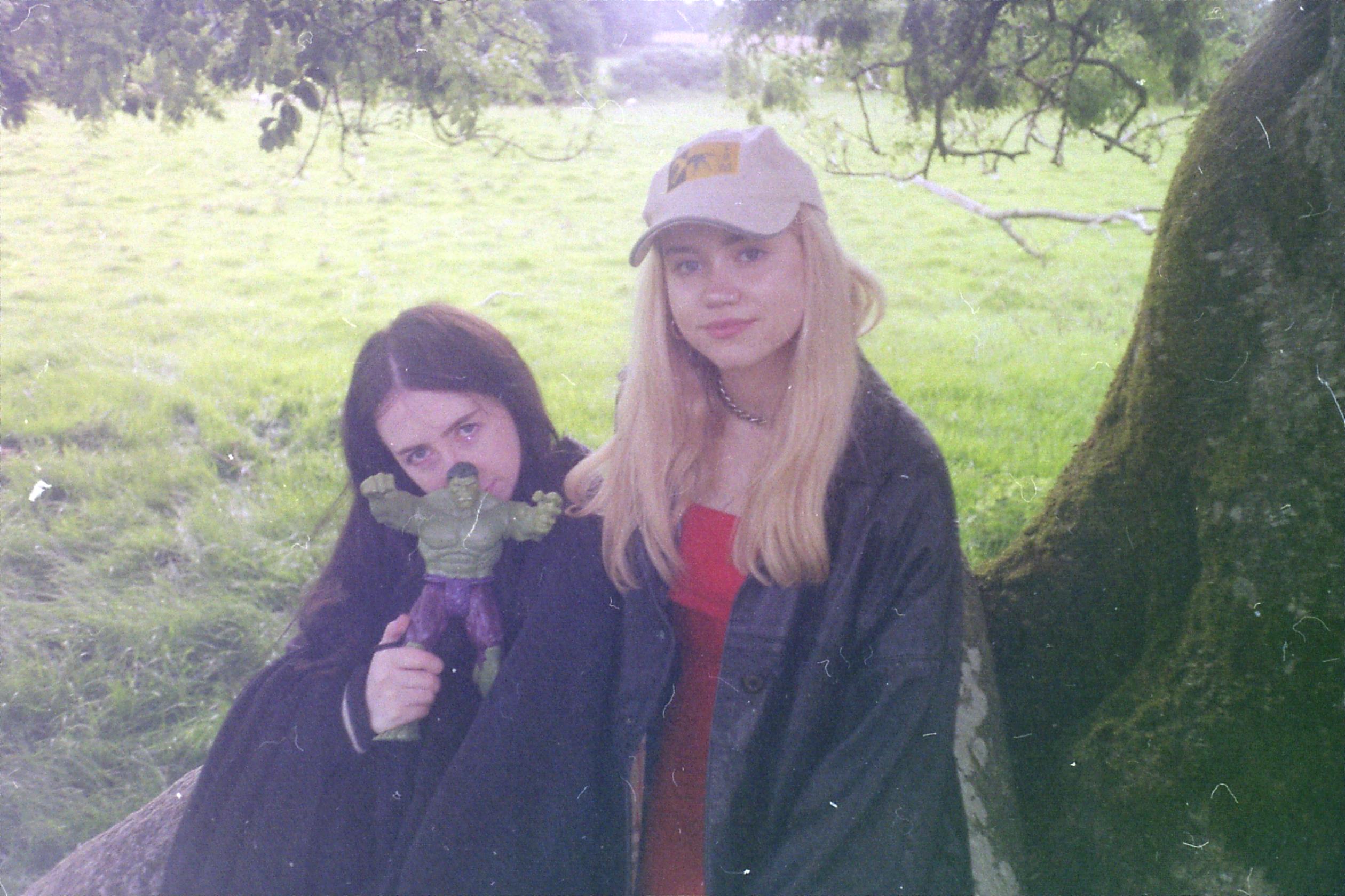 izzy and alannah in a field with a toy