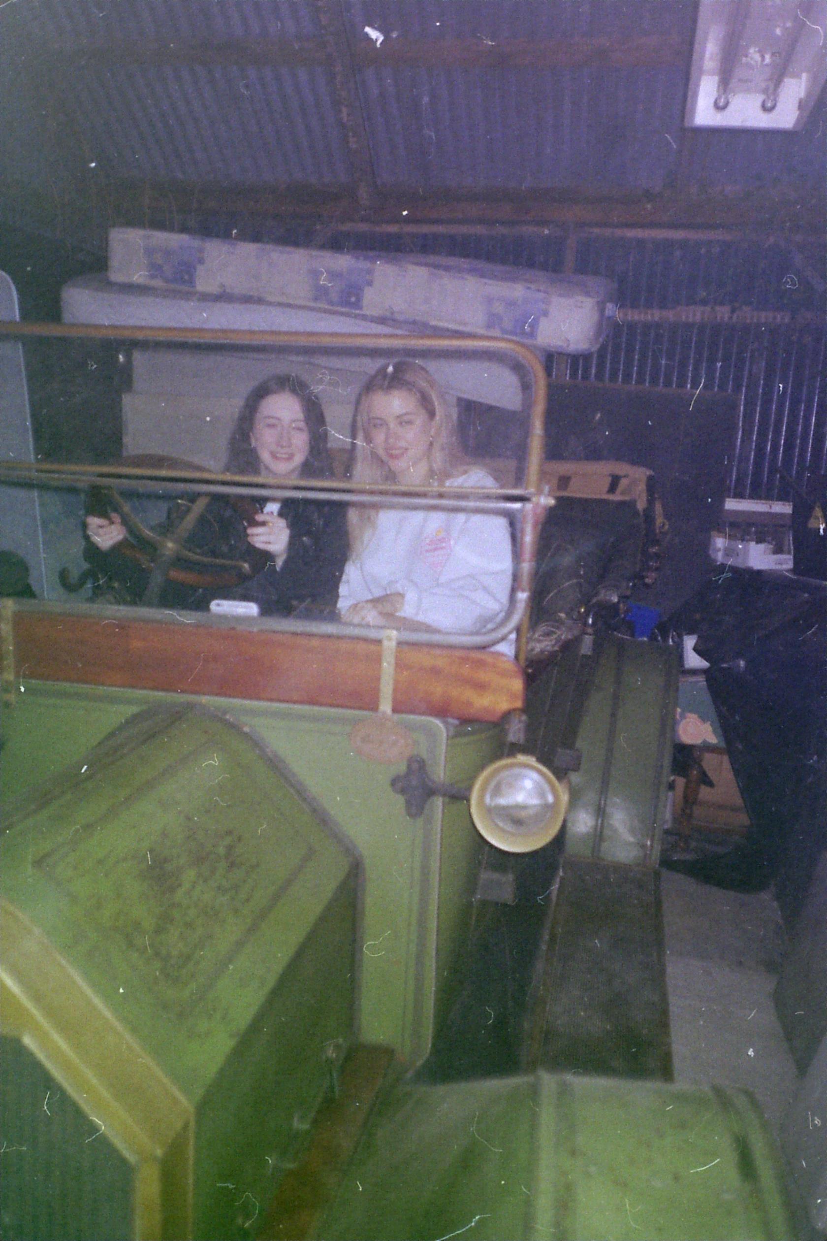 two girls in a vintage car